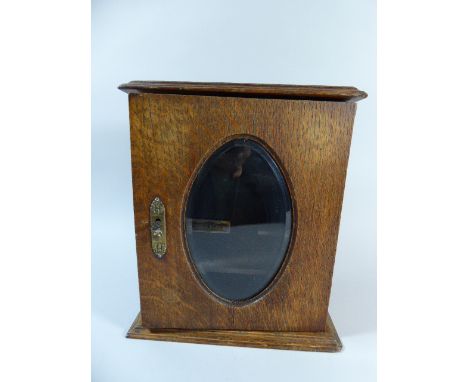 An Edwardian Oak Smokers Cabinet with Glazed Door and Lifting Lid, Containing Three Vintage Pipes, 32cm high