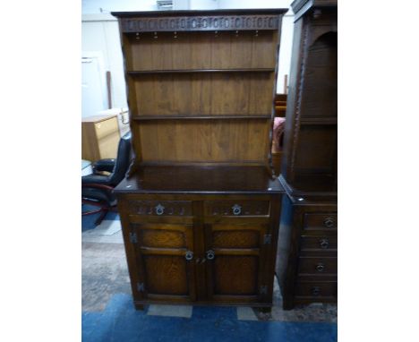 An Oak Sideboard with two Drawers Over Cupboard Base and Two Shelf Plate Rack, 93cm wide