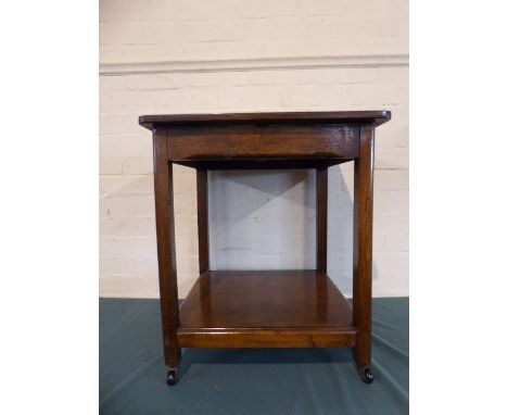 An Oak Two Tier Table with Stretcher Shelf on Casters, 15cm Square 