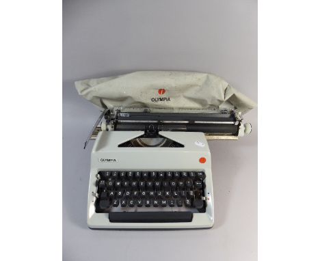 A Vintage Olympia Manual Portable Typewriter  