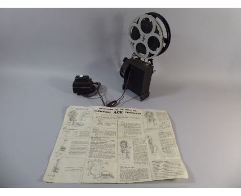 A Vintage Pathescope ACE Projector with Reel Film and Original Instruction Leaflet 