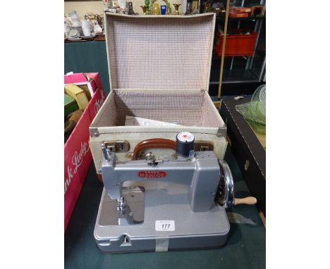 A Vintage Essex Miniature Sewing Machine In Case