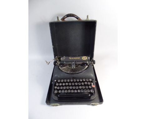 A Vintage Remington Model Five Portable Typewriter in Carrying Case 