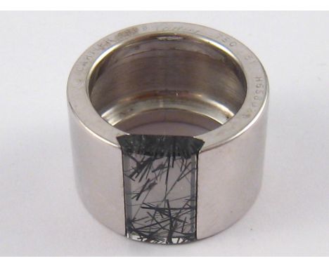 Cartier. An 18 carat white gold rutilated quartz gem ring by Cartier, signed Cartier and numbered H65802, circa 1999, size K,