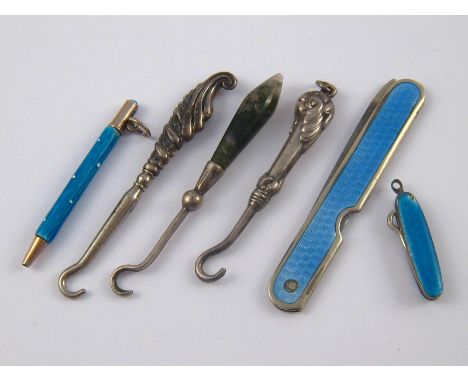 Six miniature items comprising three glove hooks, one enamelled folding hook, a folding enamelled nail file and an enamel pro