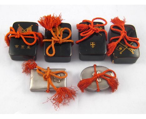 Six Japanese trinket boxes with cord ties, circa 1950; four gilt decorated black lacquer, 7x5cm., and two metal, one of which