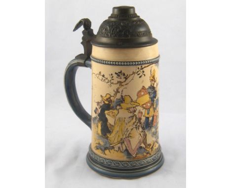 A half litre pewter lidded ceramic bierstein with scene of vagrants around a fire. ht.22cm. 