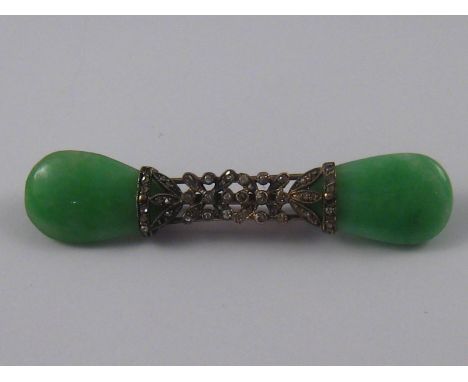A white metal (tests 18 carat gold) rose cut diamond and jade brooch, each jade approx 2cm long, brooch approx 6.3cm long, 9.