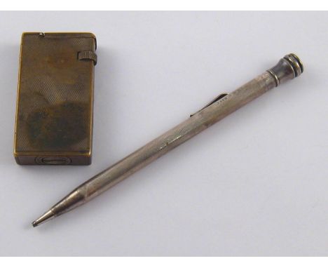 A mixed lot comprising a silver Eversharp propelling pencil and a Dunhill cigarette lighter.