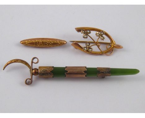 A mixed lot comprising a jade brooch (A/F) and two 9 carat gold brooches.