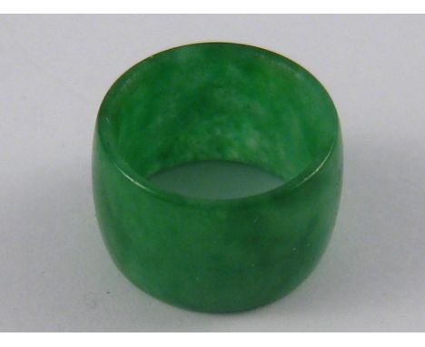 A jade pendant of fine colour, approx 8.7mm wide, 14mm diameter.
