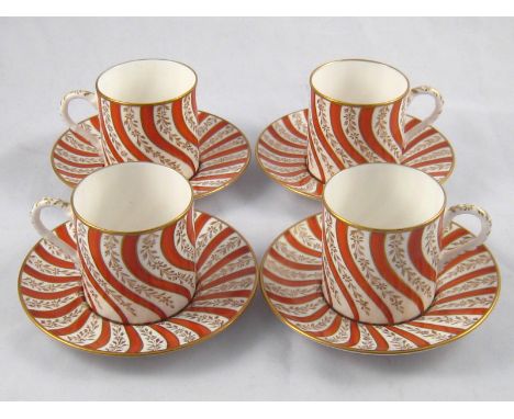 Tiffany coffee set. A set of four coffee cups and saucers , the white bodies with swirl red stripes and gilding, all marked “