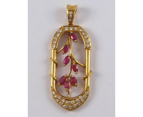 A yellow metal (tests 18 carat gold) ruby and diamond pendant, approx 4.5 cm, 7 gms.
