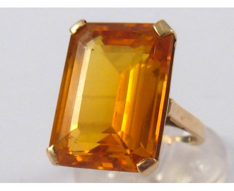 A 9 carat gold synthetic sapphire ring, stone approx. 20 x 15mm, ring size K, 9.3 gms.
