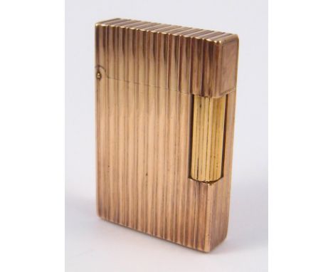 A gold plated cigarette lighter by S.J. Dupont, approx 5.5 x 3.5cm.