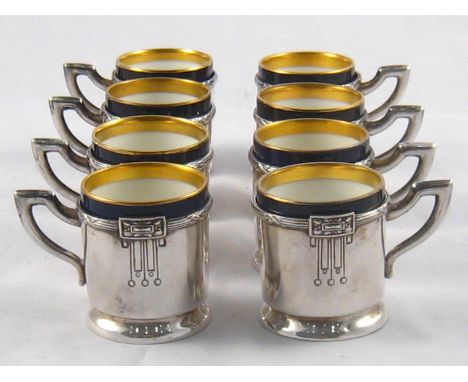 A set of eight ceramic gilt cobalt blue coffee cups in gilt lined silver holders in the Secessionist style, circa 1910. Austr