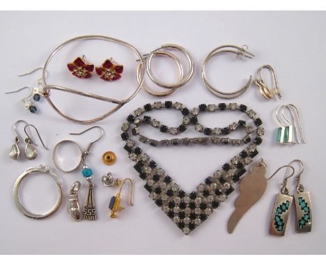 A mixed lot of white metal (tests silver) and costume jewellery including a vintage paste fringe necklace, nine pairs of earr