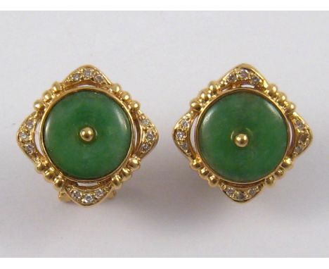 A pair of yellow metal (tests 18 carat gold) jade and diamond earrings, jades approx 10mm diameter, 8.5 gms.
