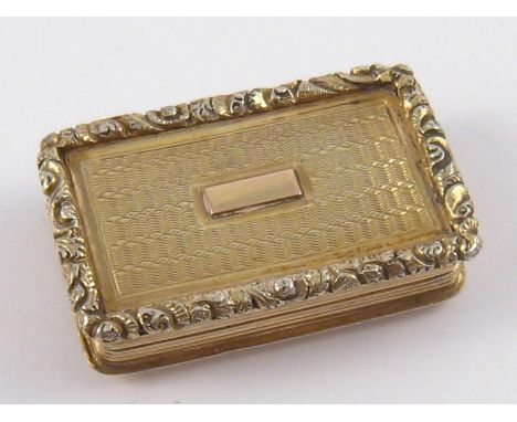 A Georgian silver gilt vinaigrette with reeded sides, engine turned faces and applied cast rim by Nathanial Mills, Birmingham