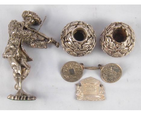 Judaica. A pair of globe wailing wall silver cased candlesticks, ht. 4.5cm., marked 925, a silver cased dancing Rabbi, ht.16c