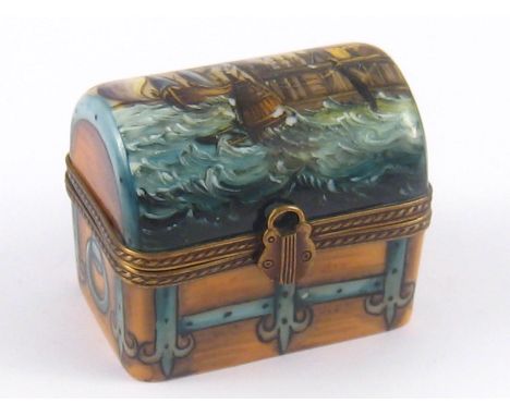 A small limoges trinket box shaped as a treasure chest, Limoges stamp and "Exclusif Chamart Peint a la main" 5x3.5x5cm. 