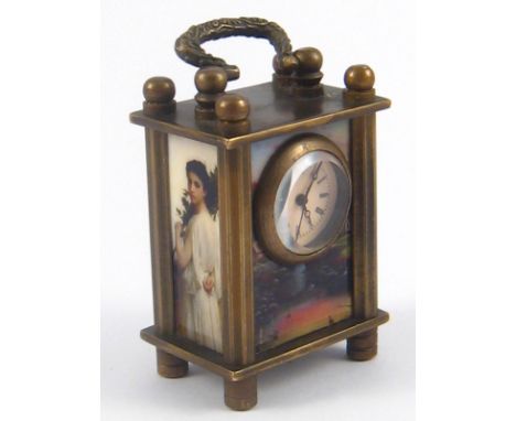 A miniature carriage clock, the sides and back with panels of ladies and fairies, a blue cabochon winder button underneath. H
