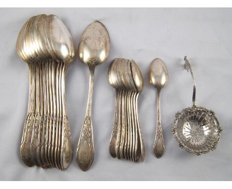 A set of twelve table and eleven teaspoons, all German 800 assay silver, and a continental silver sifter ladle. wt. 1080 gm. 