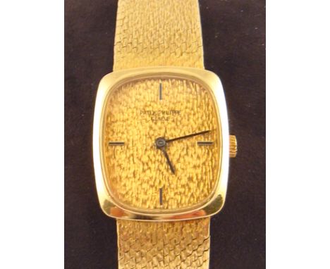 Patek Philippe . A lady's 18 carat gold wristwatch with integral 18 carat gold bracelet, case numbered 2676728  4107  1, the 