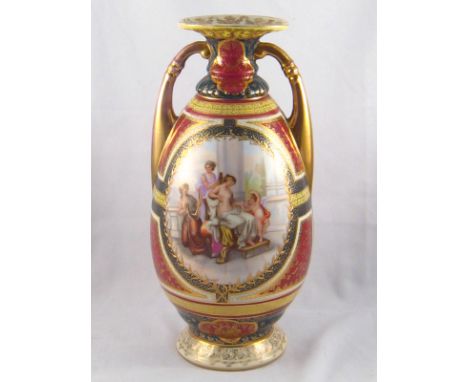 A Vienna style ceramic two handled vase with scene of a lady and attendants at her toilet. Blue beehive mark to base. ht.40cm