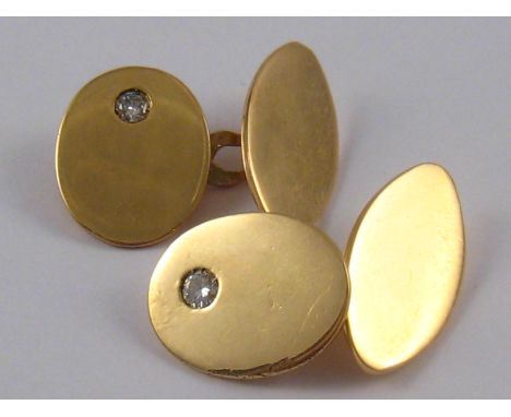 A pair of yellow metal (tests 18 carat gold) diamond cufflinks, approx 10.9 gms.