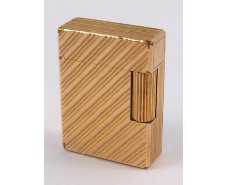 A gold plated Dupont gas cigarette lighter in protective pouch. 