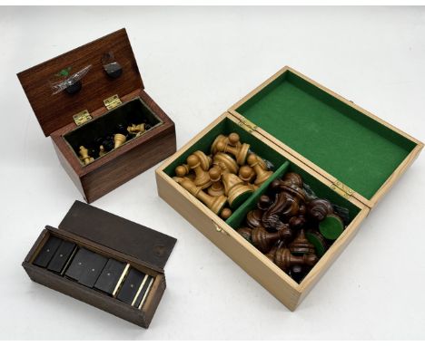 Two boxed chess sets including larger example in geometric patterned box and a set of bone dominoes 