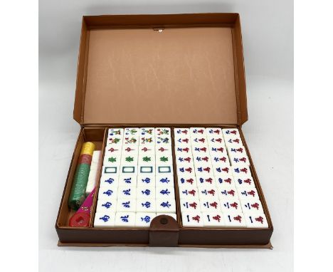 A vintage Mahjong set in leather carry case