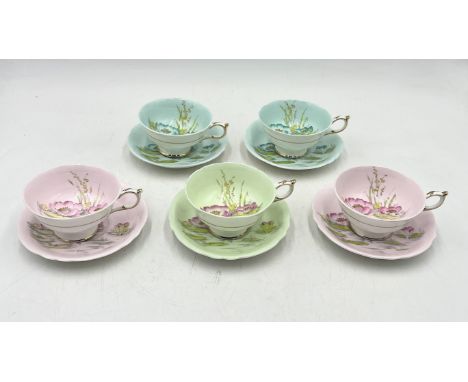 A set of five Paragon teacups with water lily design in various colours 