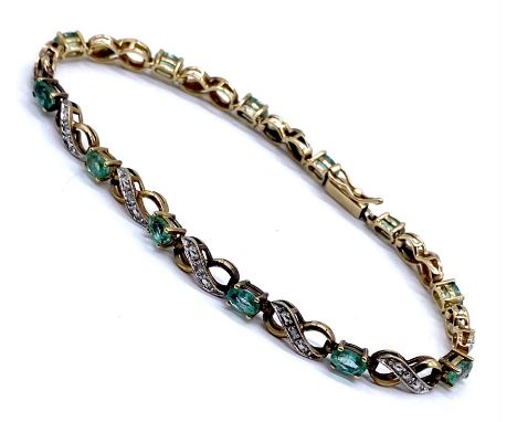 A 9k gold emerald and diamond tennis bracelet, with fitted safety clasp, 7.7g total weight, 20cm total length.