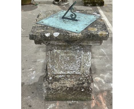 A weathered stone garden sundial on square plinth base - 57cm x 45cm