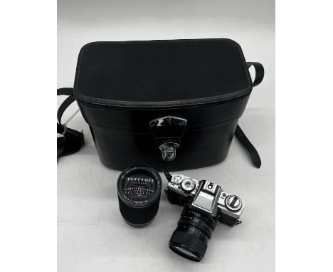 A vintage Minolta XG-M Camera with MD Zoom lens along with a Tokina SZ-X lens and travel case  