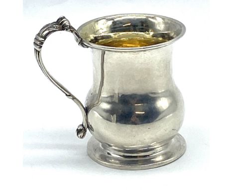 An antique Russian silver pedestal christening mug with silver gilt interior, 113.9g.