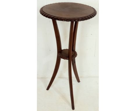 A vintage mahogany two tier plant stand with gadrooned edge detail on tripod base 43cm diameter 82cm high.