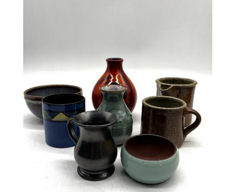 An assortment of studio pottery including Poole, Watcombe Torquay, Alderney, Campden and Brickhurst etc the height of the tal