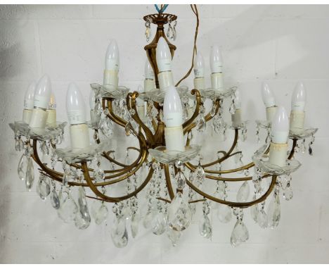A vintage crystal and gilt metal eighteen branch chandelier 80cm diameter.