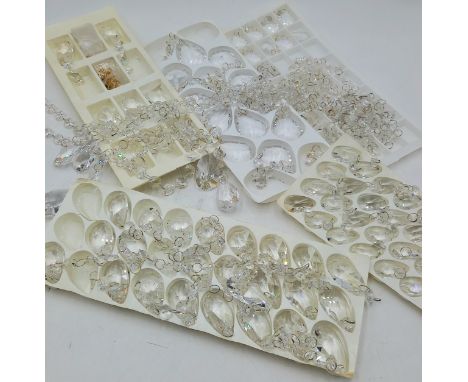A collection of assorted vintage crystal chandelier drops.