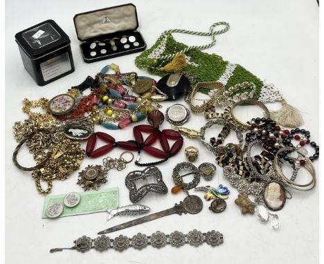 A collection of assorted vintage and fashion costume jewellery to include Monet gold-tone chains etc.