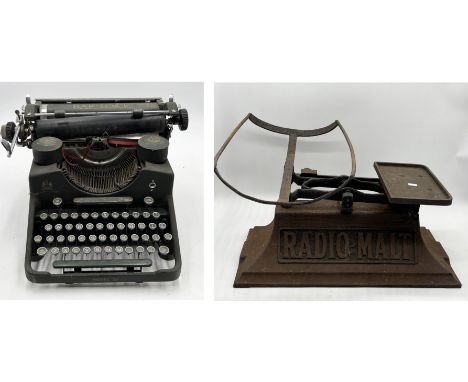 A Bar-Lock Model 21 typewriter along with a vintage Radio Malt scales 