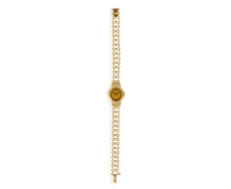 A LADY'S 18K GOLD WATCH, BY HERMÈS, the manual wind movement with circular dial, batons for numerals, polished gold case and 