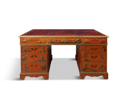 A CHINOISERIE RED LACQUER PEDESTAL DESK, the rectangular top fitted with gilt -tooled leather writing panel, decorated to the