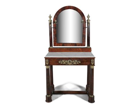 AN EMPIRE MAHOGANY AND BRASS MOUNTED DRESSING TABLE, with surmounted arch top crutch frame mirror above a white marble top, f