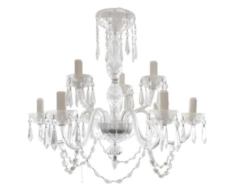 A WATERFORD 'LISMORE' NINE BRANCH CUT GLASS CHANDELIER, with scroll arm branches, hung with pendant droplets and facet bead c