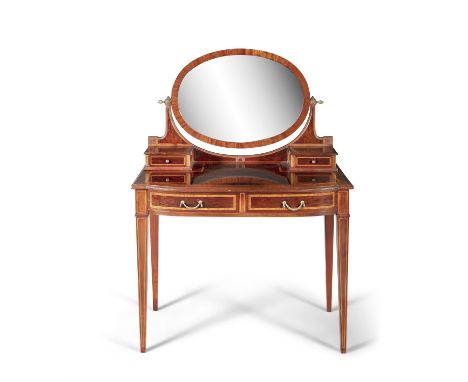 AN INLAID MAHOGANY BOWFRONT DRESSING TABLE, with oval crutch frame mirror above twin surmounted small drawers and a pair of f