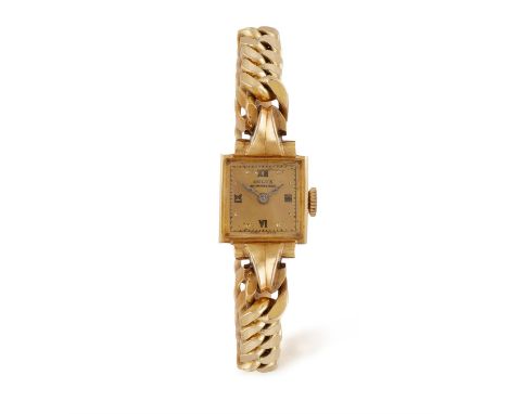 AN 18K GOLD MANUAL WIND WATCH BY DULUX, of manual wind movement with square champagne dial, Roman and dots for numerals and g